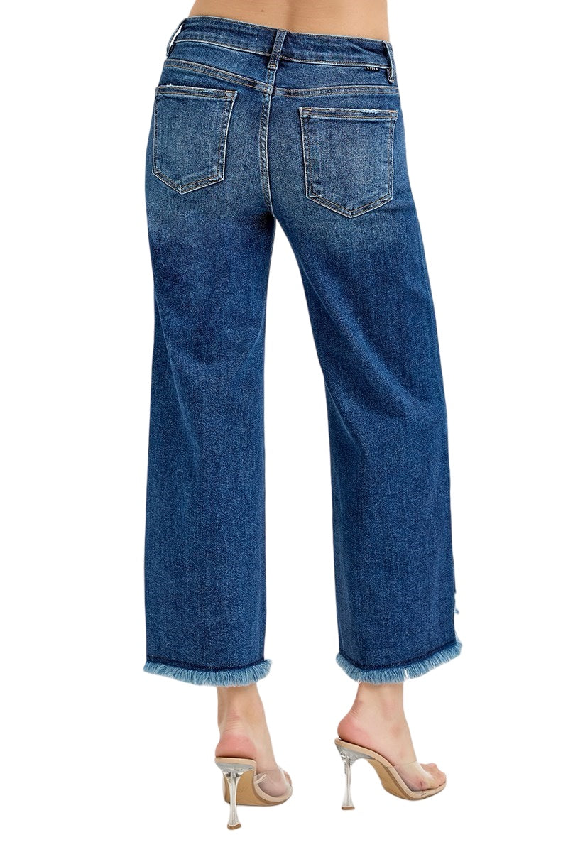 Risen Wide Leg Raw Edge Hem Jeans in a Dark Wash