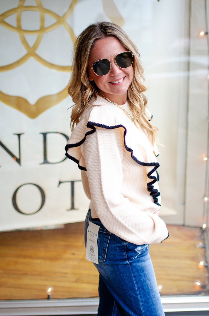 Walk The Line Long Sleeve Cream Knit Sweater with a Black Trim Ruffle Detail