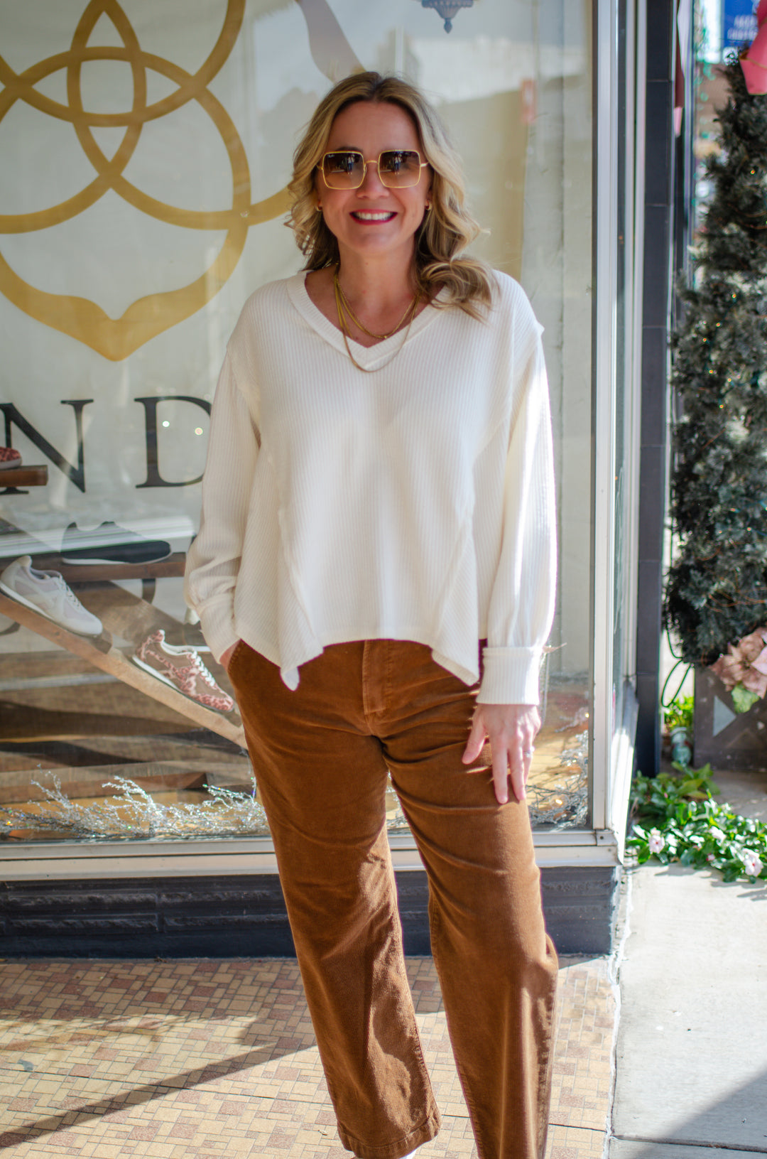 Our Love V-Neck Long Sleeve Side Cut Top in Cream