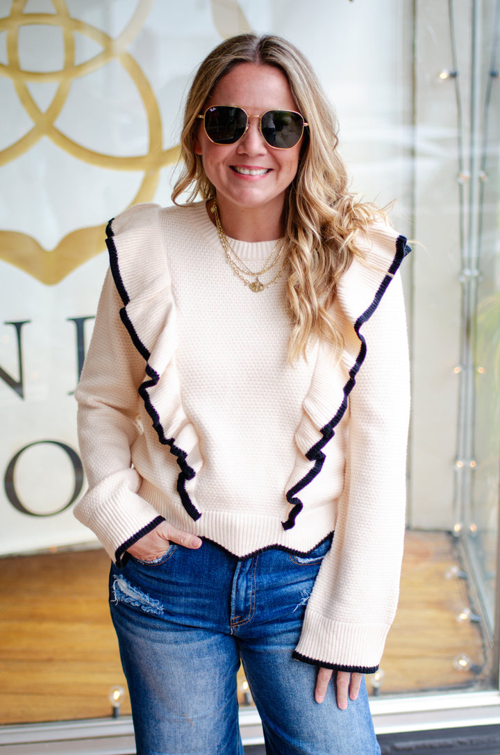 Walk The Line Long Sleeve Cream Knit Sweater with a Black Trim Ruffle Detail