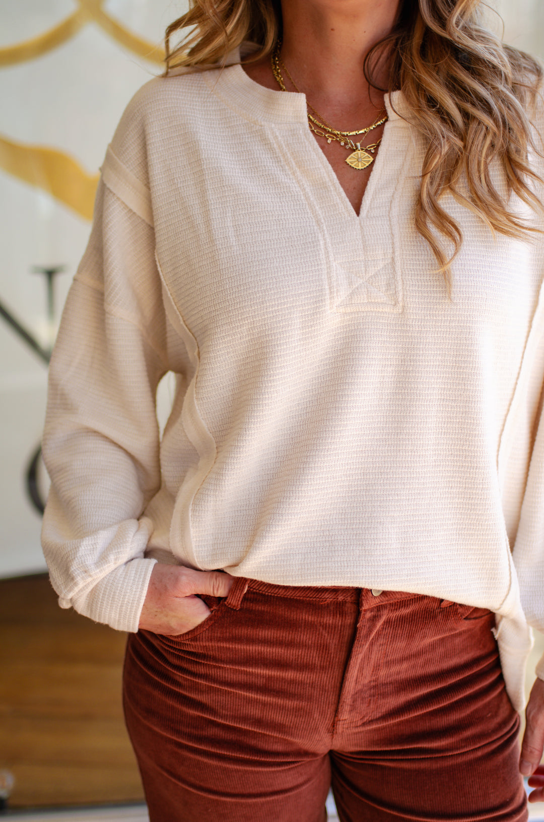 Cozy Day Split Neck Exposed Seam Long Sleeve Knit Top In Cream