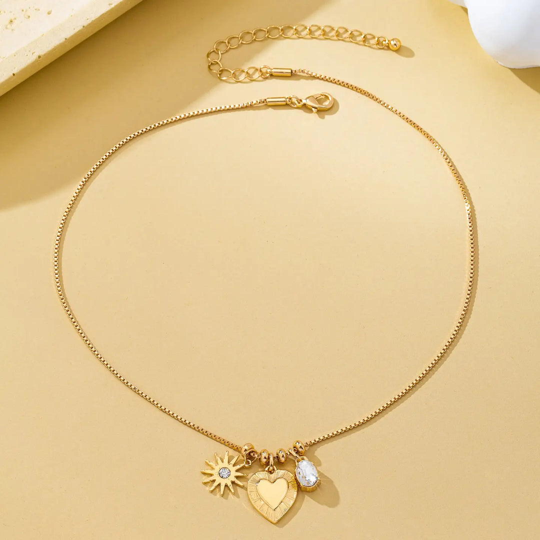 Celestial Heart and Starburst Charm Necklace in Gold