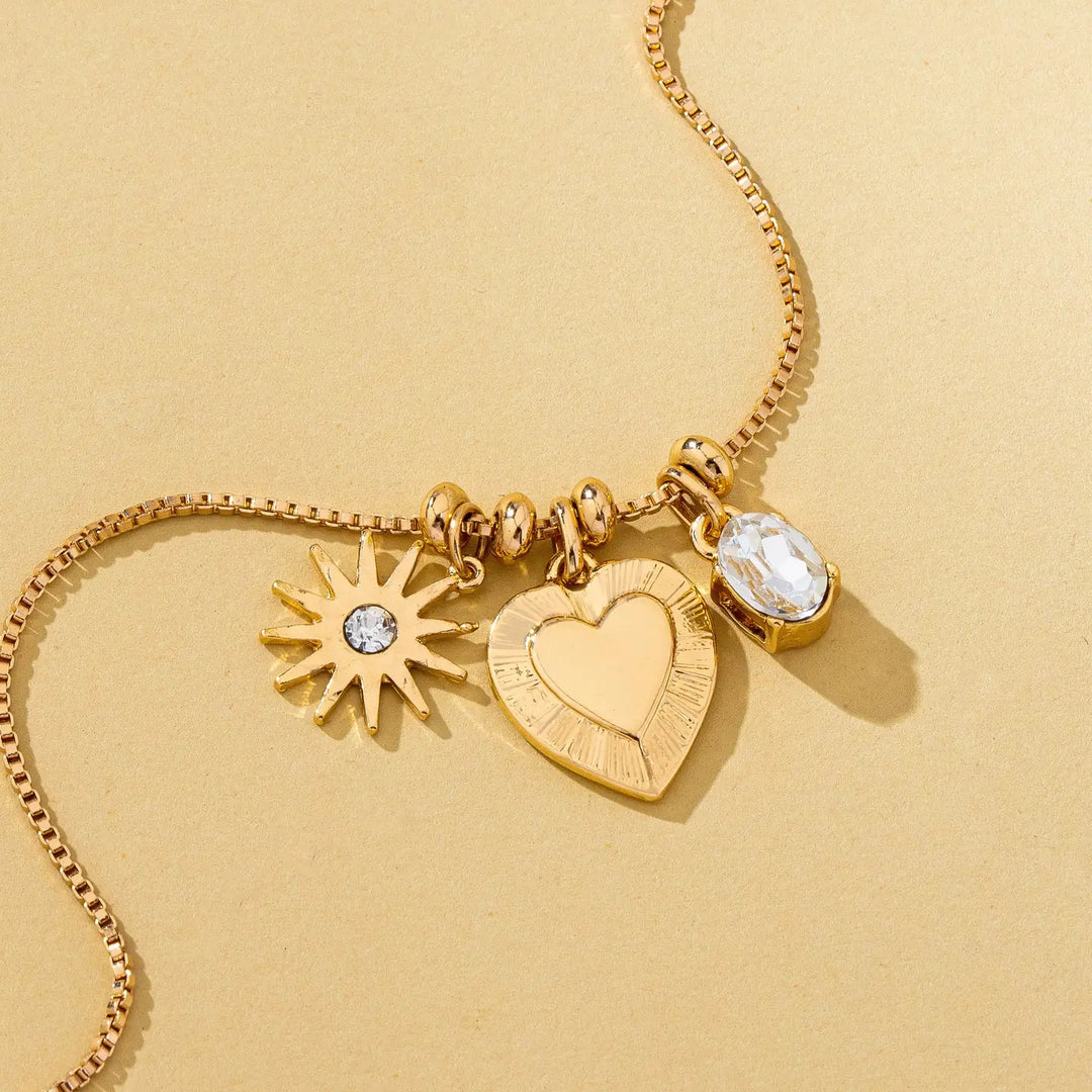 Celestial Heart and Starburst Charm Necklace in Gold