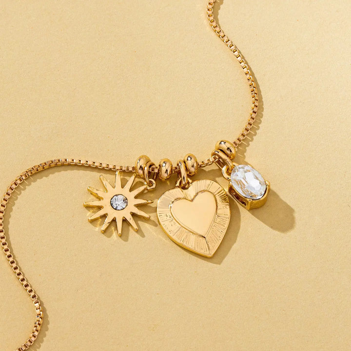 Celestial Heart and Starburst Charm Necklace in Gold