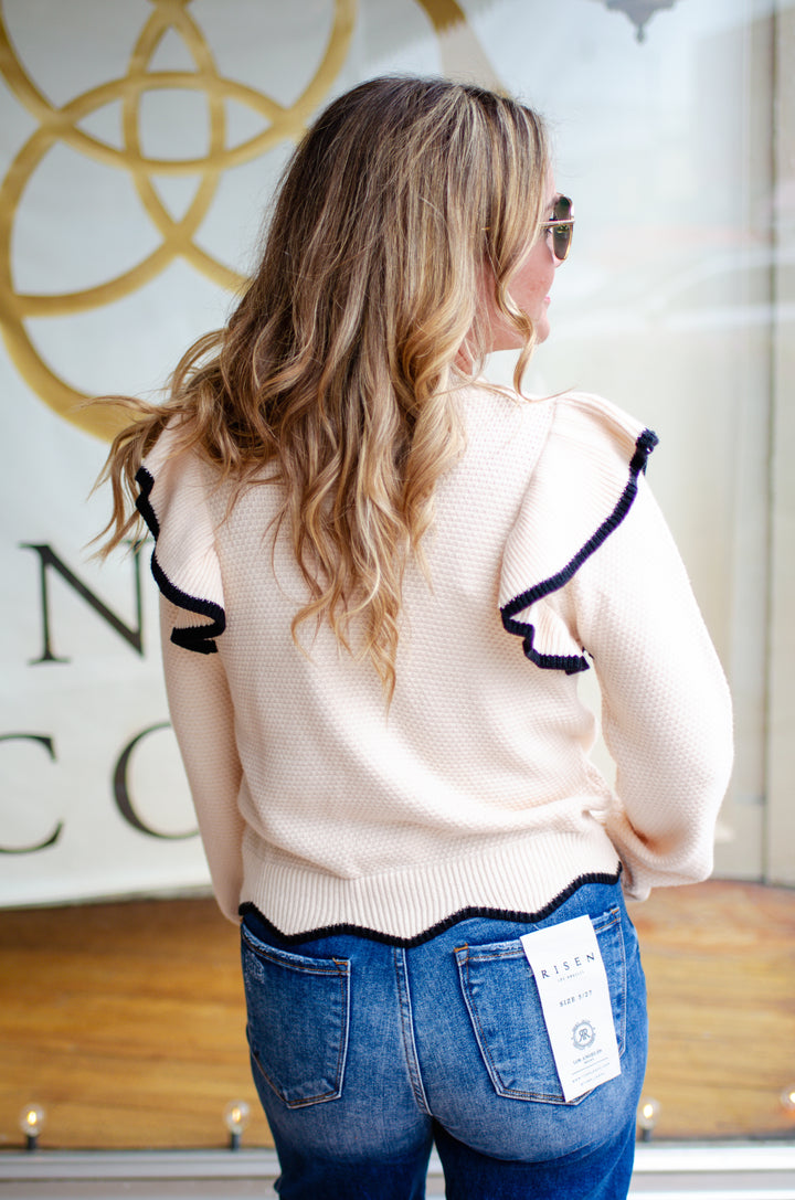 Walk The Line Long Sleeve Cream Knit Sweater with a Black Trim Ruffle Detail