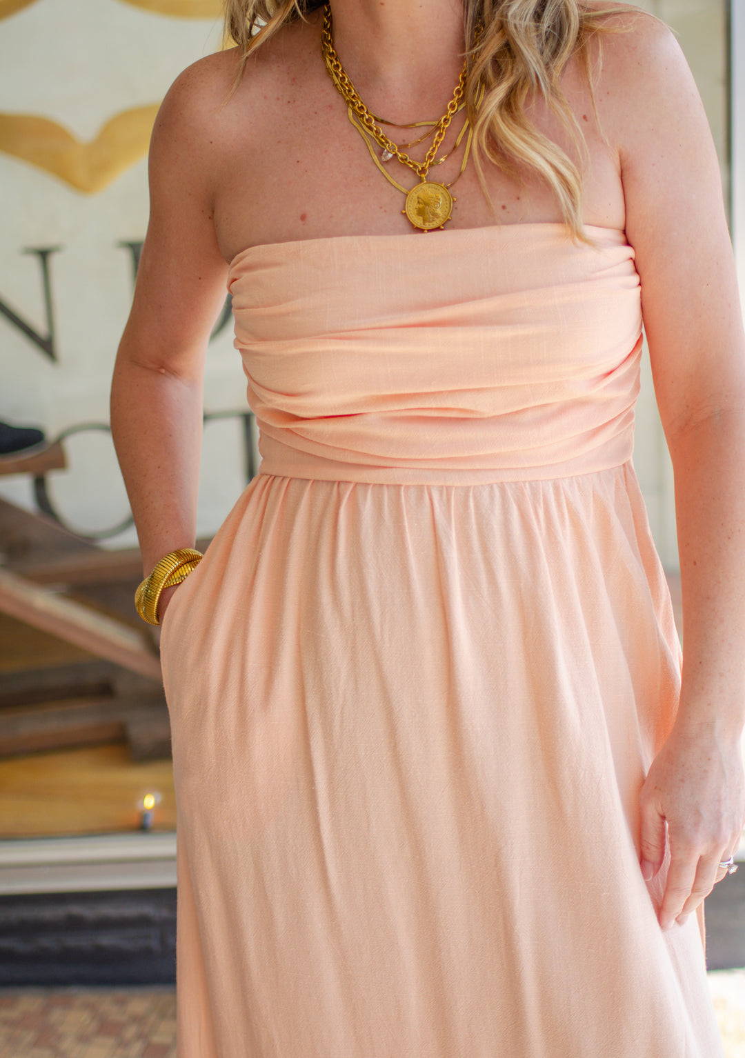 La Dolce Vita Strapless Empire Waistline Midi Dress in Peach