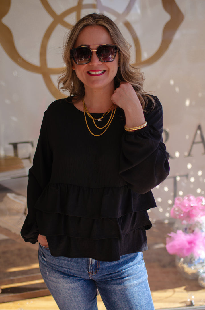 Send My Love Black Ruffle Hem Long Sleeve Top in Black