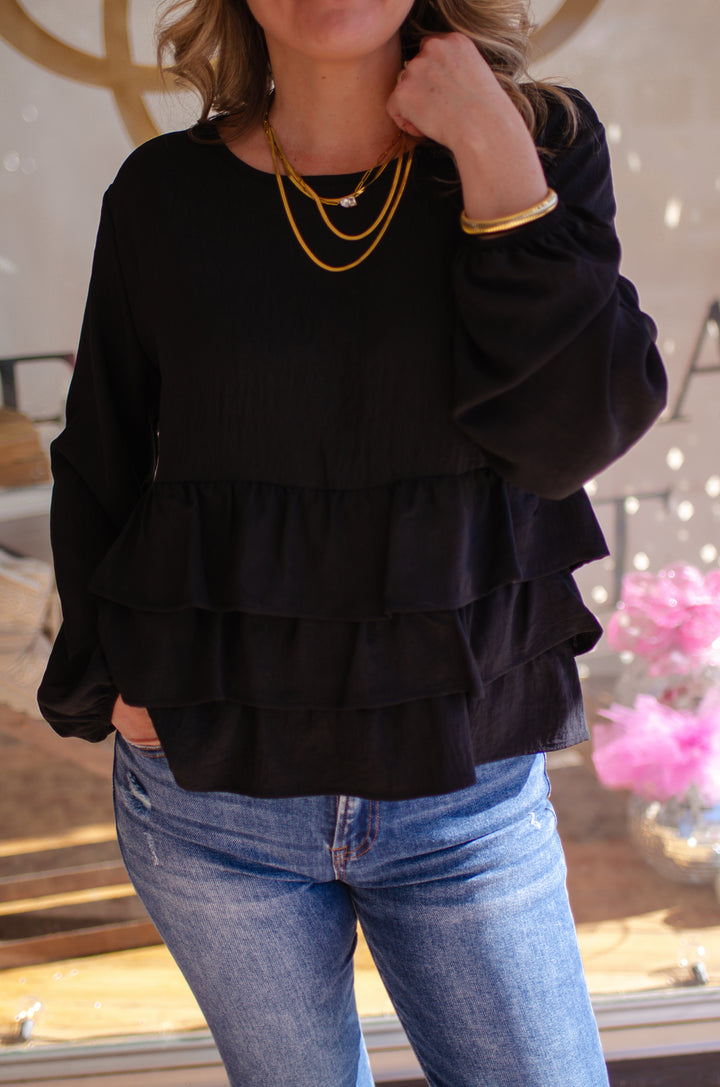 Send My Love Black Ruffle Hem Long Sleeve Top in Black