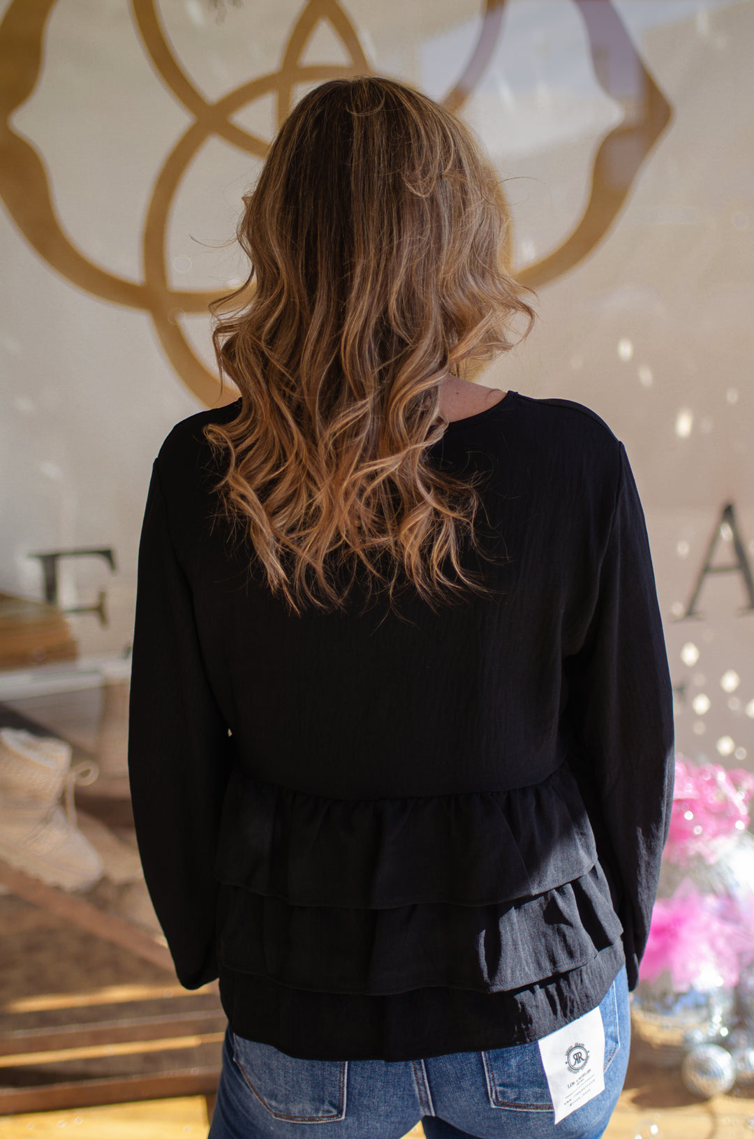 Send My Love Black Ruffle Hem Long Sleeve Top in Black